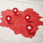 A detailed map with red areas and location markers showcasing medical facilities or services.